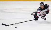 <p>Canada’s Mike Matheson dives for the puck during the Ice Hockey World Championships group B match between Canada and Norway in the AccorHotels Arena in Paris, France, May 15, 2017. (Photo: Petr David Josek/AP) </p>