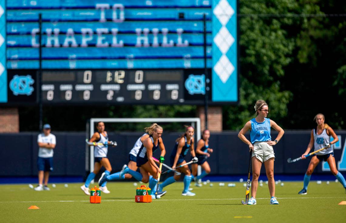 North Carolina field hockey coach Erin Matson watches her team during their first practice of the season on Wednesday August 9, 2023 at Karen Shelton Stadium in Chapel Hill, N.C. Matson, a four time National Champion playing at North Carolina, became the head coach in January, 2023 replacing coach Karen Shelton, who retired.