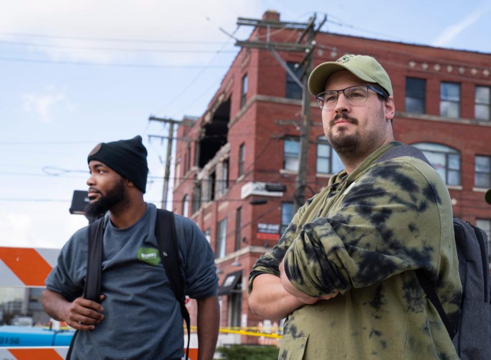 Beyond Juicery and Eatery regional manager Mike Tinsley, 32, of Detroit, left, and co-owner Matthew Andrus, 29, of Westland, talk about the uncertain future of their store Tuesday, Sept. 19, 2023, after the building where their business was housed, partially collapsed in Eastern Market on Saturday, Sept. 16, 2023.