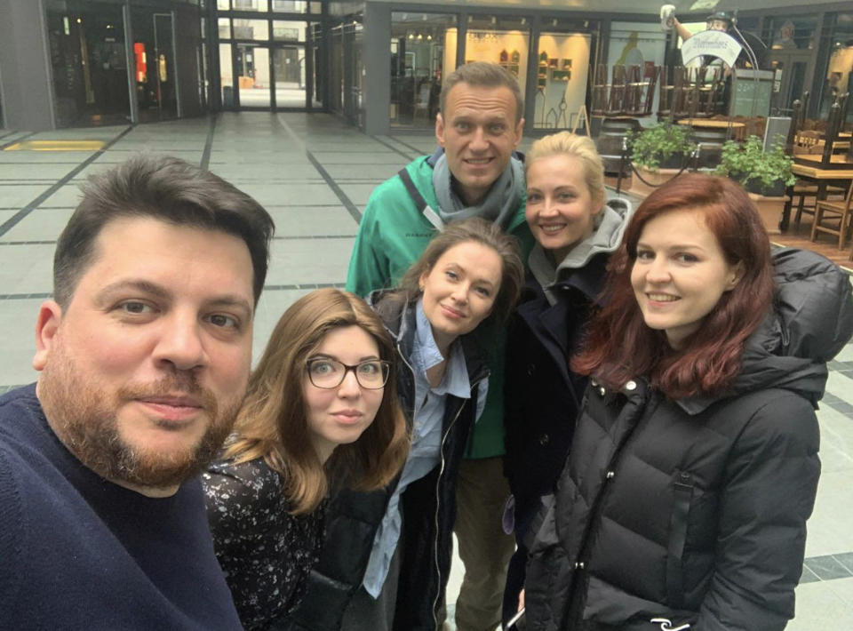 This photo released by Leonid Volkov's Twitter account on Sunday, Jan. 17, 2021, shows Russian opposition activist Alexei Navalny with his wife, Yulia, and friends in Germany before he returned to Moscow. Rattled by nationwide protests over Navalny, Russian authorities are moving rapidly to block any new ones – from piling legal pressure on his allies to launching a campaign to discredit the demonstrations. (Leonid Volkov via AP)