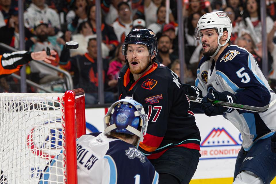 Coachella Valley Firebirds Max McCormick (#17) watches intently as the puck whizzes past his face during game 6 of the matchup against the Milwaukee Admirals at Acrisure Arena on June 5, 2023.