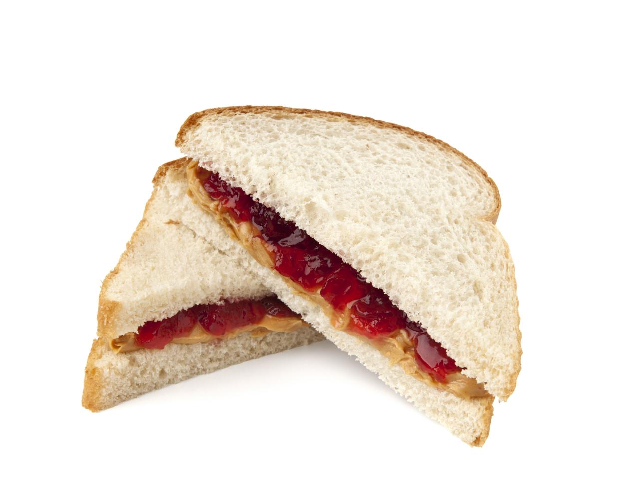 Peanut butter and jelly sandwich with clipping path on white background.  Please see my portfolio for other food and drink images.