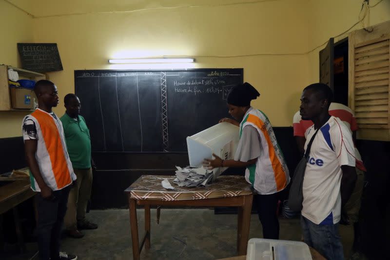 Election officials start to count the ballots during the presidential election in Abidjan