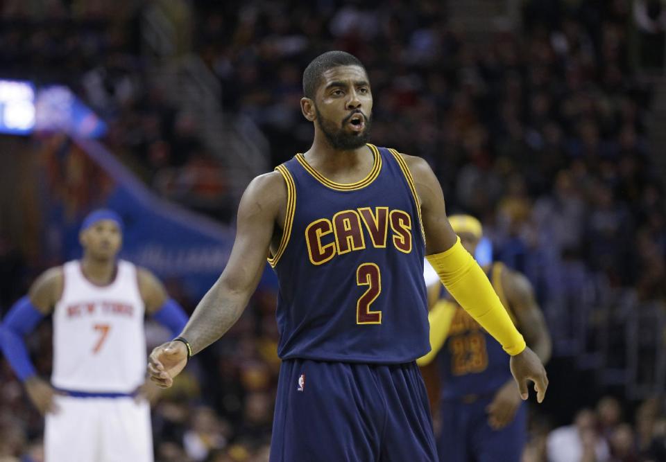 Cleveland Cavaliers&#39; Kyrie Irving (2) reacts during an NBA basketball game against the New York Knicks Thursday, Oct. 30, 2014, in Cleveland. (AP Photo/Tony Dejak)