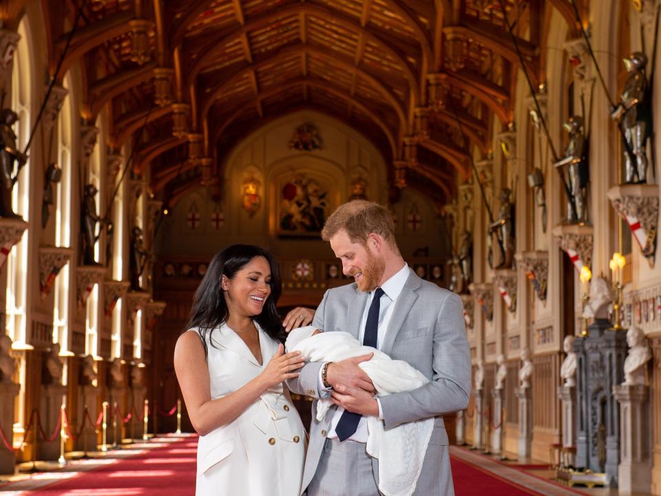 FILE PHOTO: Britain's Prince Harry and Meghan, Duchess of Sussex are seen with their baby son, who was born on Monday morning, during a photocall in St George's Hall at Windsor Castle, in Berkshire, Britain May 8, 2019. Dominic Lipinski/Pool via REUTERS