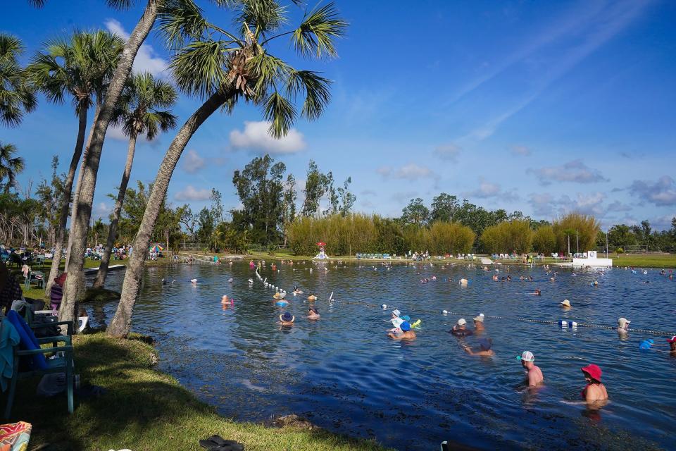 Visitors enjoy Warm Mineral Springs on April 7, the first day it reopened after Hurricane Ian.