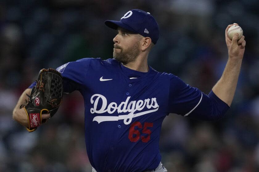 Los Angeles Dodgers starting pitcher James Paxton throws during a the second inning of a spring training baseball game against the Cincinnati Reds, Thursday, Feb. 29, 2024, in Goodyear, Ariz. (AP Photo/Carolyn Kaster)