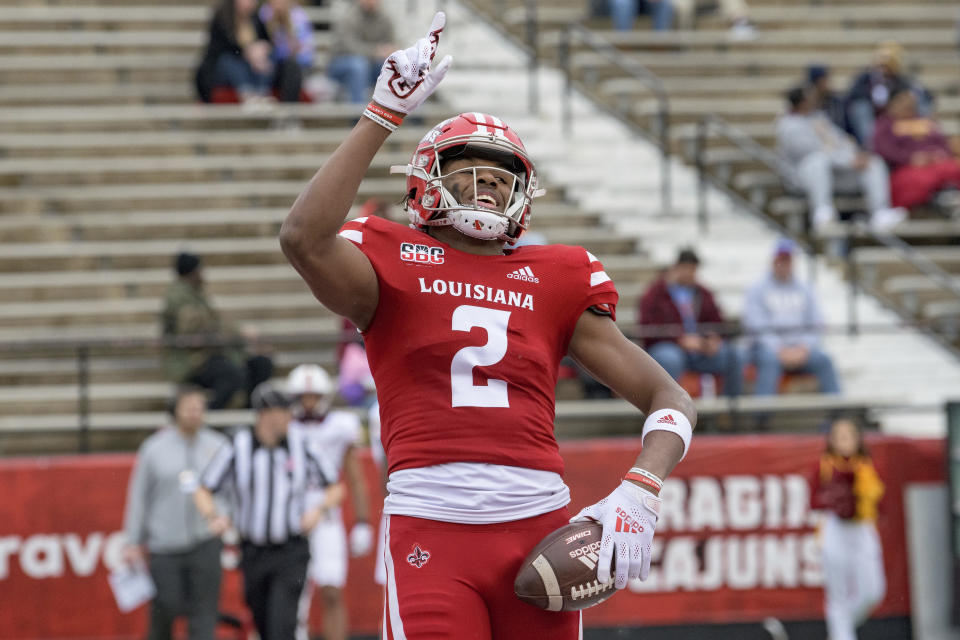 Louisiana-Lafayette wide receiver Kyren Lacy (2) celebrates a touchdown against Louisiana-Monroe in the first half an NCAA college football game in Lafayette, La., Saturday, Nov. 27, 2021. (AP Photo/Matthew Hinton)