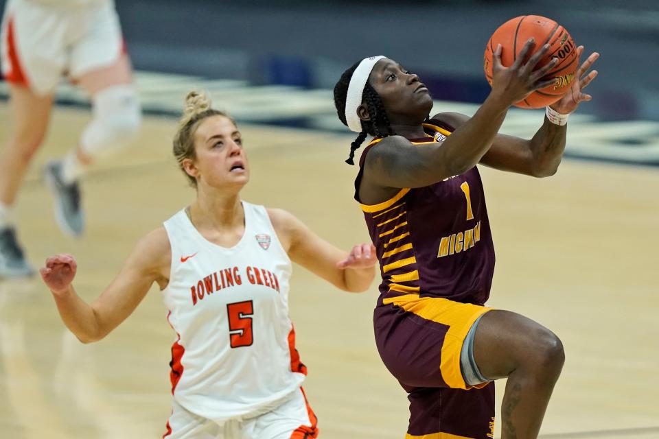 Central Michigan's Micaela Kelly drives to the basket against Bowling Green's Elissa Brett during the first half of CMU's 77-72 win in the MAC tournament final on Saturday, March 13, 2021, in Cleveland.