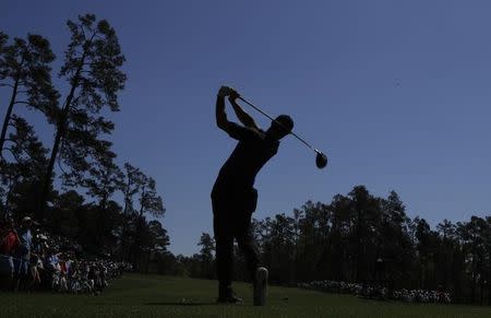 Rory McIlroy of Northern Ireland hits off the 14th tee during Tuesday practice rounds for the 2017 Masters at Augusta National Golf Club in Augusta, Georgia, U.S., April 4, 2017. REUTERS/Lucy Nicholson