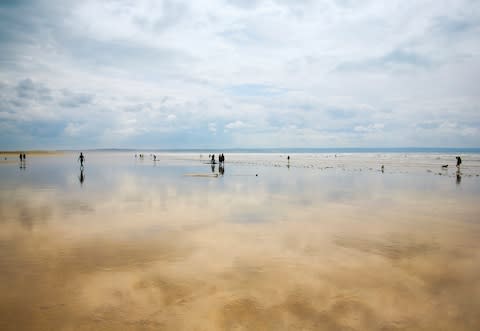 Saunton Sands itself takes on an epically reflective titanium sheen at low tide - Credit: getty