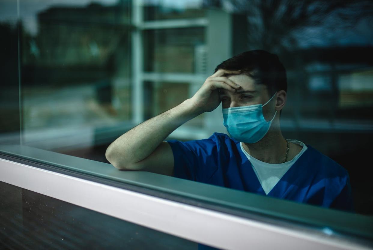 <span class="caption">Many nurses are physically and emotionally exhausted from the toll of COVID-19.</span> <span class="attribution"><a class="link " href="https://www.gettyimages.com/detail/photo/male-nurse-struggles-with-mental-health-royalty-free-image/1309350765" rel="nofollow noopener" target="_blank" data-ylk="slk:lightspeedshutter/iStock via Getty Images Plus;elm:context_link;itc:0;sec:content-canvas">lightspeedshutter/iStock via Getty Images Plus</a></span>