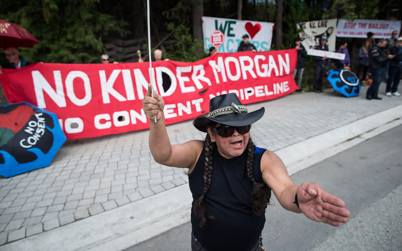 An anti-pipeline demonstration takes place in Whistler, B.C., on June 2, 2018. Those against the Trans Mountain pipeline expansion project have reacted with joy in response to a federal court ruling that rejected its approval. Photo from Getty Images.