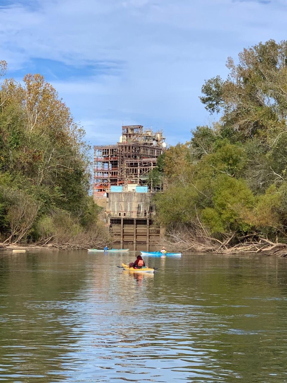 RiverTrek kayakers look at the former Scholz Power Plant along Apalachicola River.