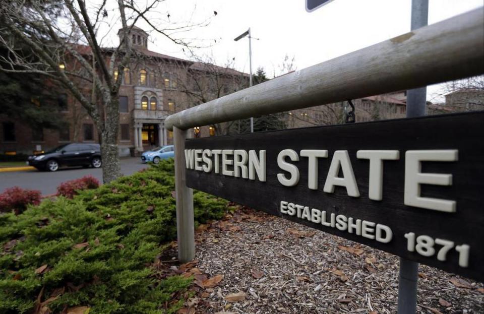 This file photo shows a sign near the main entrance of Western State Hospital, the largest psychiatric hospital in the state, in Lakewood, Washington.