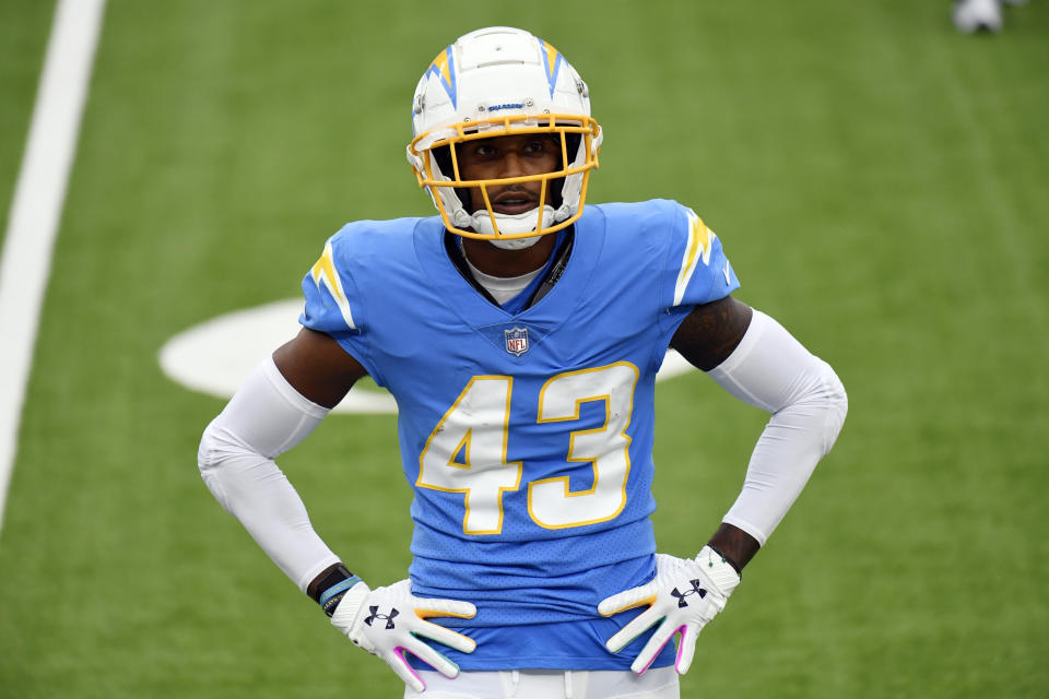 FILE - In this Oct. 25, 2020, file photo, Los Angeles Chargers cornerback Michael Davis warms up before an NFL football game against the Jacksonville Jaguars in Inglewood, Calif. A person familiar with the negotiations told The Associated Press that the Chargers have agreed to re-sign Davis for three years. (AP Photo/Kyusung Gong, File)