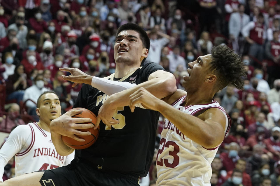 Purdue's Zach Edey (15) is fouled by Indiana's Trayce Jackson-Davis (23) during the first half of an NCAA college basketball game, Thursday, Jan. 20, 2022, in Bloomington, Ind. (Darron Cummings)