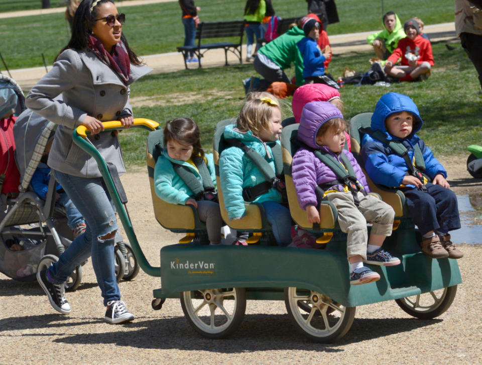 WASHINGTON, D.C. - APRIL 20, 2018: A daycare center employee pushes a KinderVan filled with preschool children on an outing along the National Mall in Washington, D.C.<span class="copyright">Getty Images—Robert Alexander</span>