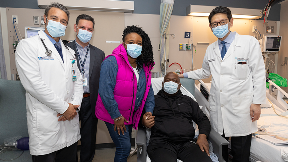 Rick Slayman with doctors during discharge (Massachusetts General Hospital)