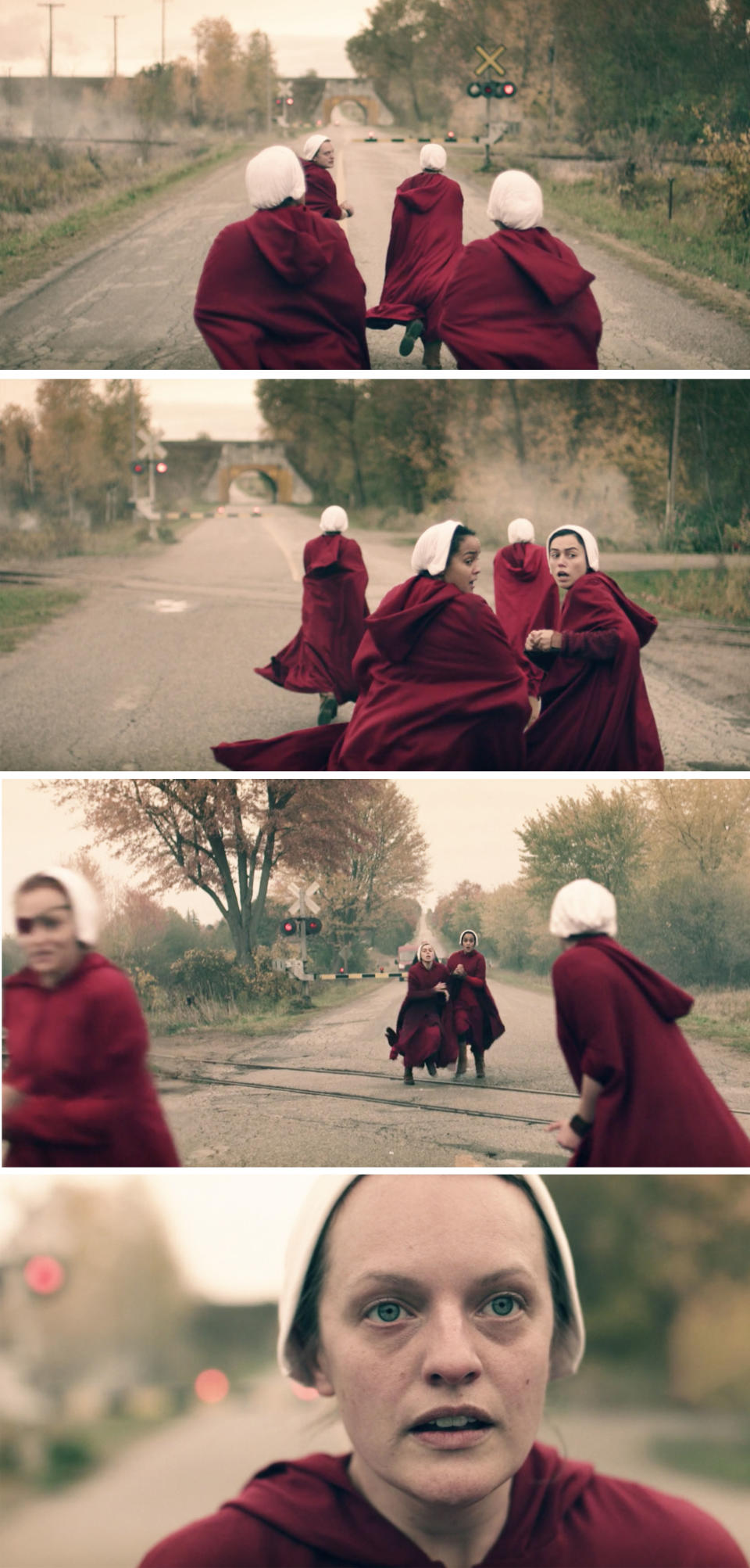 The Handmaid's running down a road towards the train tracks