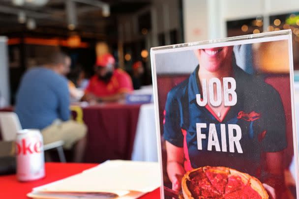 PHOTO: Job seekers speak with recruiters during a job fair at Navy Pier, April 11, 2023, in Chicago. (Scott Olson/Getty Images)