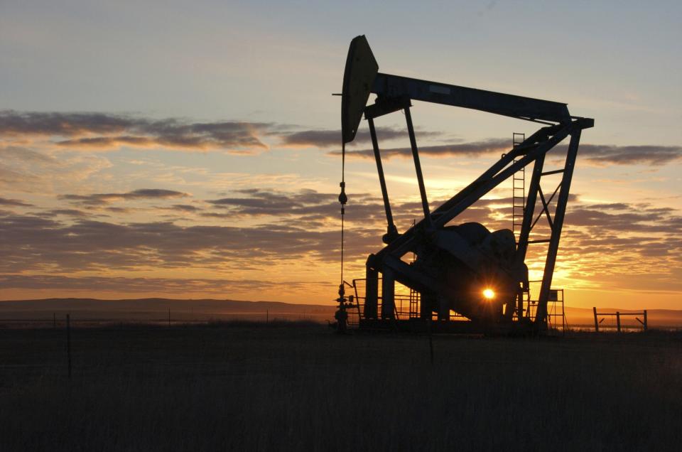 FILE - This Nov. 6, 2013 file photo shows a Whiting Petroleum Co. pump jack pulls crude oil from the Bakken region of the Northern Plains near Bainville, Mont. A federal judge has ruled that the Trump administration's leading steward of public lands has been serving unlawfully and blocked him from continuing in the position. U.S. District Judge Brian Morris said Friday, Sept. 25, 2020, that U.S. Bureau of Land Management acting director William Perry Pendley was never confirmed to the post by the U.S. Senate and served unlawfully for 424 days. Montana's Democratic governor had sued to remove Pendley, saying the the former oil industry attorney was illegally overseeing a government agency that manages almost a quarter-billion acres of land, primarily in the U.S. West. (AP Photo/Matthew Brown, File)