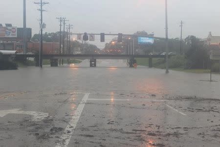 The Acadian Thruway is covered in floodwaters in this handout picture from the Louisiana Department of Transportation and Development taken in Baton Rouge, Louisiana, U.S. August 12, 2016. Louisiana Department of Transportation and Development/Handout via Reuters