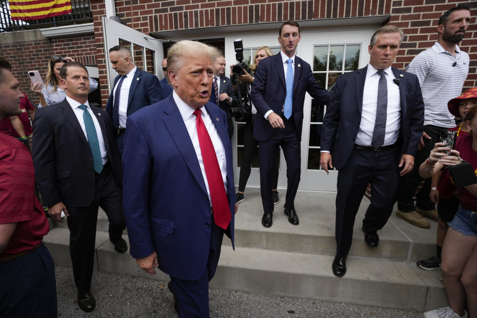 Former President Donald Trump visits the Alpha Gamma Rho, agricultural fraternity, at Iowa State University before an NCAA college football game between Iowa State and Iowa, Saturday, Sept. 9, 2023, in Ames, Iowa. (AP Photo/Charlie Neibergall)