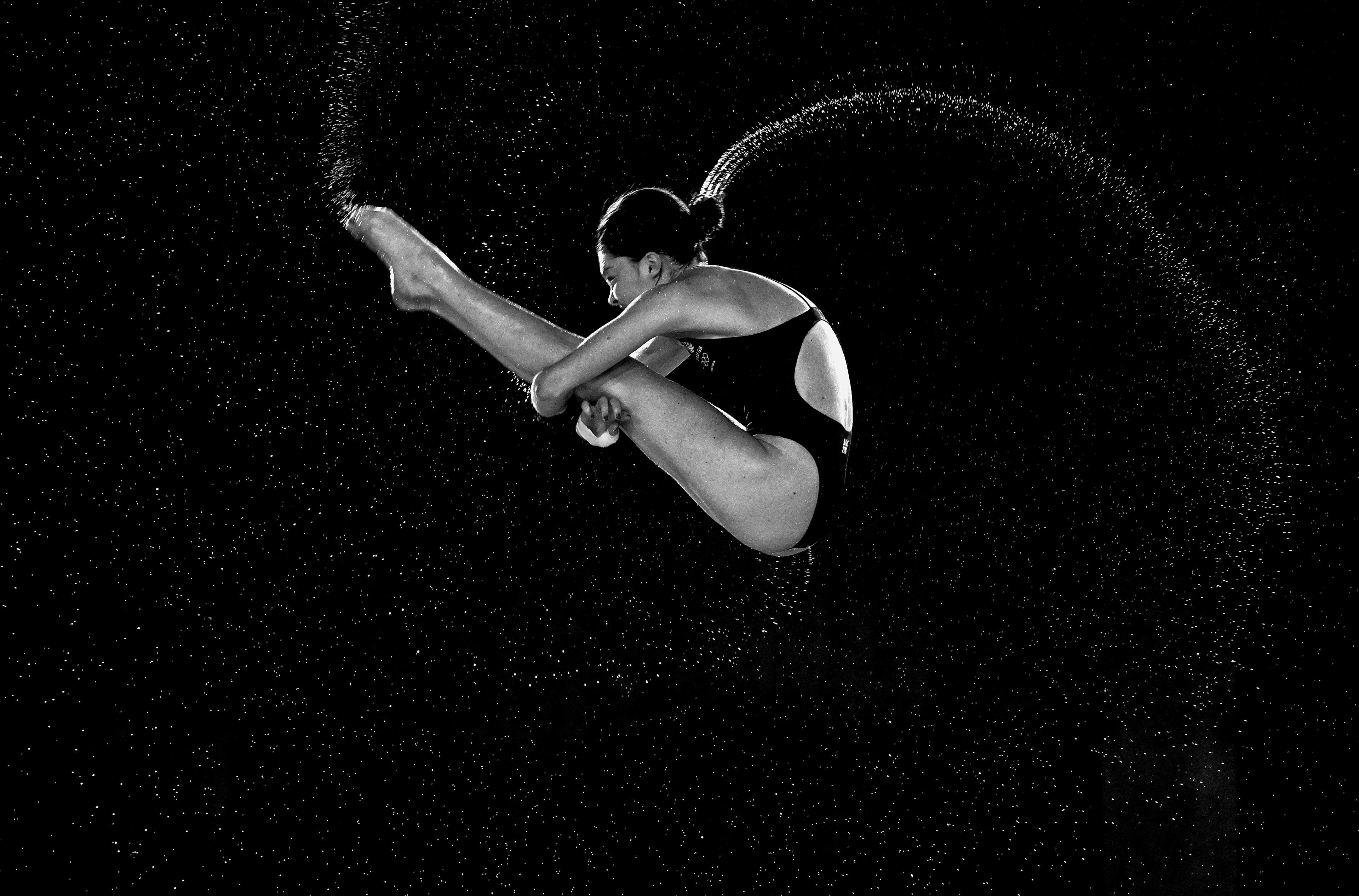 PARIS, FRANCE - AUGUST 05: (Editor's Note: Image has been converted to black and white.) Andrea Sirieix Splendolini of Great Britain in action during the Women's 10m Platform Preliminary stage of the Diving on day ten of the Olympic Games Paris 2024 at Aquatics Centre on August 05, 2024 in Paris, France. (Photo by Bradley Kanaris/Getty Images)