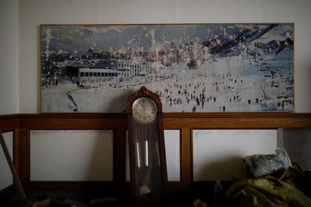 A poster of the snow-covered resort hangs on a wall at the abandoned Alps Ski Resort located near the demilitarised zone separating the two Koreas in Goseong, South Korea, January 17, 2018. REUTERS/Kim Hong-Ji