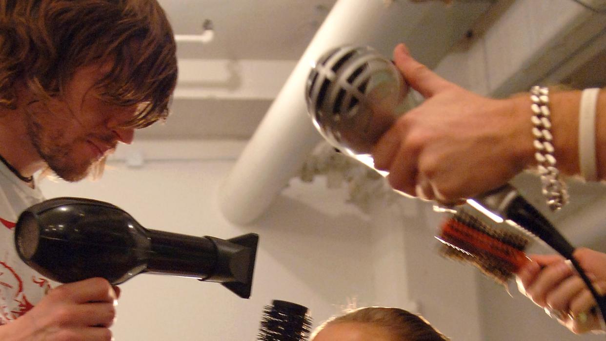 a person getting the hair done