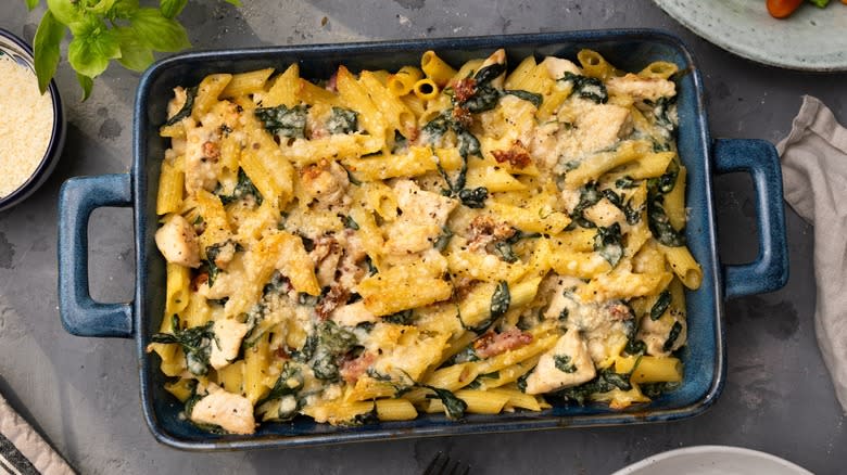 Top-down view of a dish of baked penne pasta 