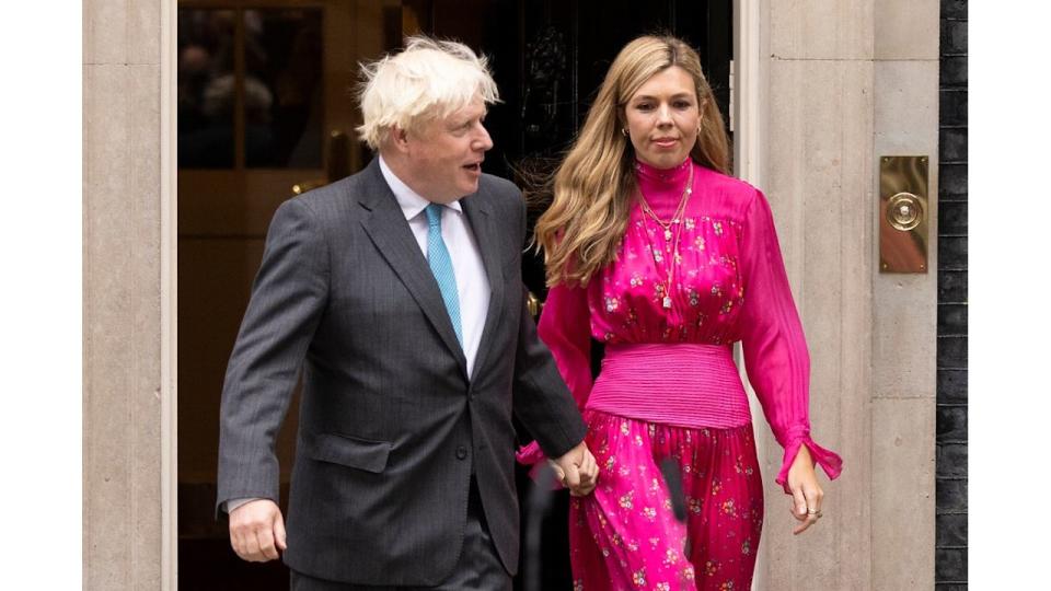 Former Prime Minister Boris Johnson and wife Carrie Johnson at Downing Street.Carrie is wearing a pink dress 