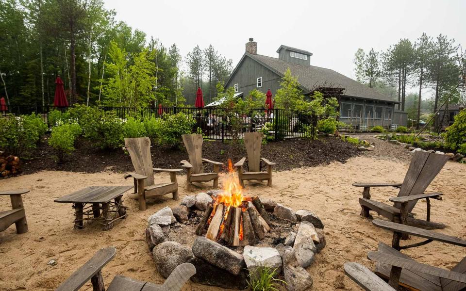 campfire at hidden pond in maine, good housekeeping's pick for best family vacation destinations