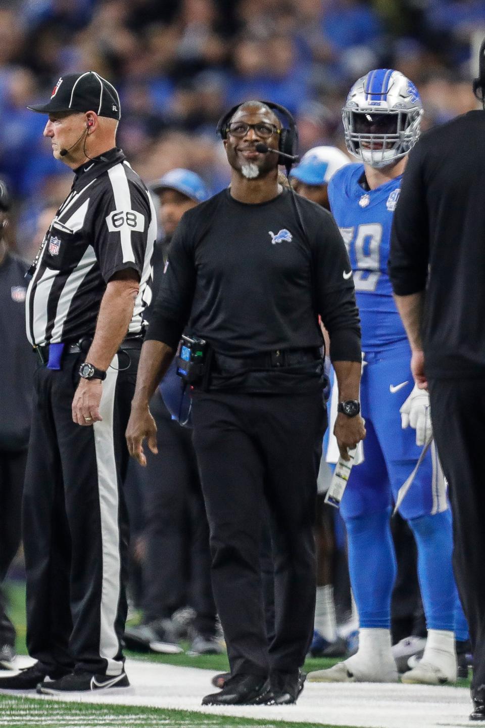 Detroit Lions defensive coordinator Aaron Glenn watches a play against Tampa Bay Buccaneers during the second half of the NFC divisional round Sunday in Detroit.