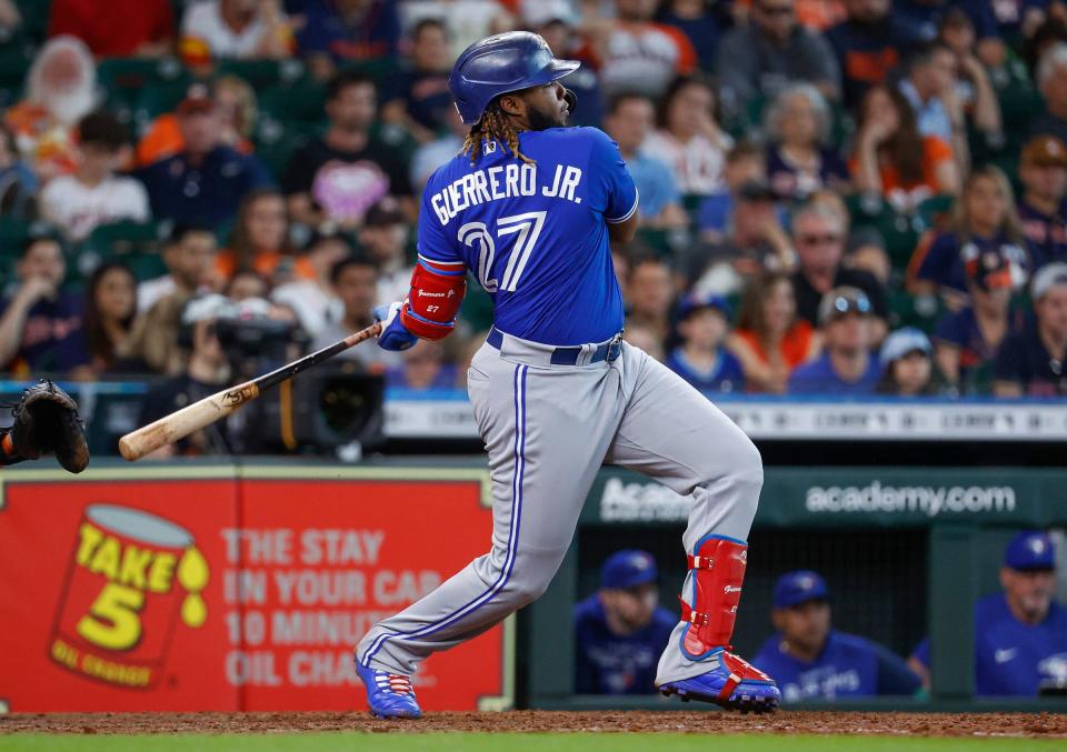 The two Vladimir Guerreros are nearing 3,000 MLB hits combined; Vlad Sr. had 2,590 and Vlad Jr. entered Monday with 392 at age 23.