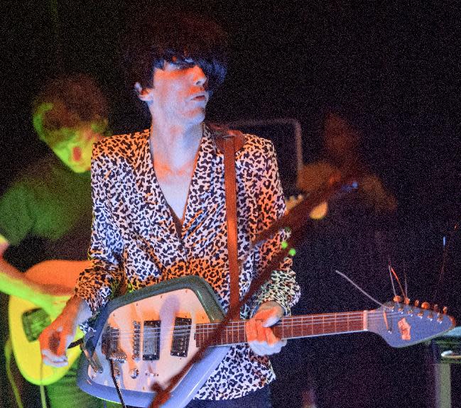 Bradford Cox plays his guitar along with other members of the indie rock group Deerhunter, perform at One Eyed Jack's in the French Quarter in New Orleans, Monday, April 29, 2013. (AP Photo/Matthew Hinton)