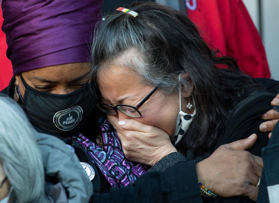 Jo-Ann Yoo, executive director of the Asian American Federation, cries after speaking in March at a press conference outside a building where a 65-year-old Asian American woman was attacked in New York. The attack, which took place on a sidewalk in broad daylight in Midtown Manhattan on March 29, was caught on CCTV footage from inside an adjacent building.