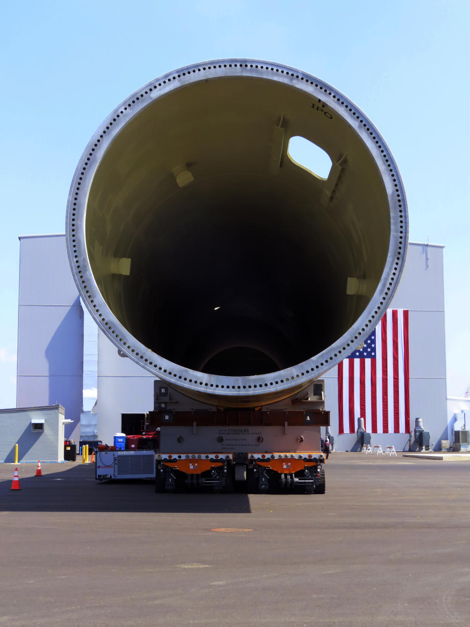 A giant monopile, the foundation for an offshore wind turbine, sits on rollers at the Paulsboro Marine Terminal in Paulsboro, N.J. on Thursday, July 6, 2023, when New Jersey Gov. Phil Murphy planned to sign a bill granting a tax break to offshore wind developer Orsted. (AP Photo/Wayne Parry)