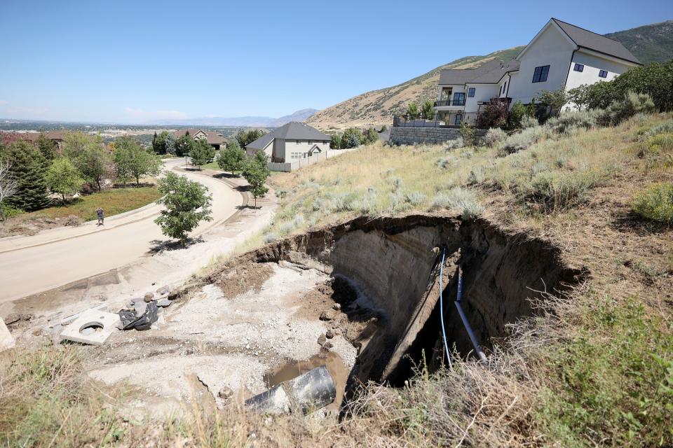 The aftermath of a mudslide is pictured near Rambling Road and Sage Hollow Drive in Draper on Friday, Aug. 4, 2023. Draper Mayor Troy Walker declared a state of emergency due to flooding. | Kristin Murphy, Deseret News