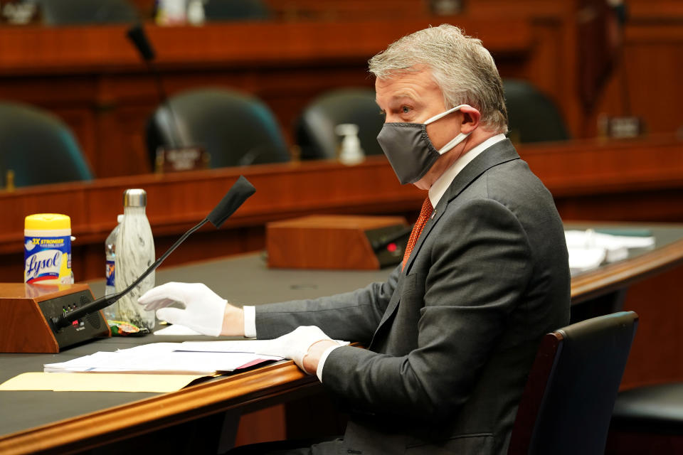 Richard Bright, former director of the Biomedical Advanced Research and Development Authority, wears a face mask during testimony