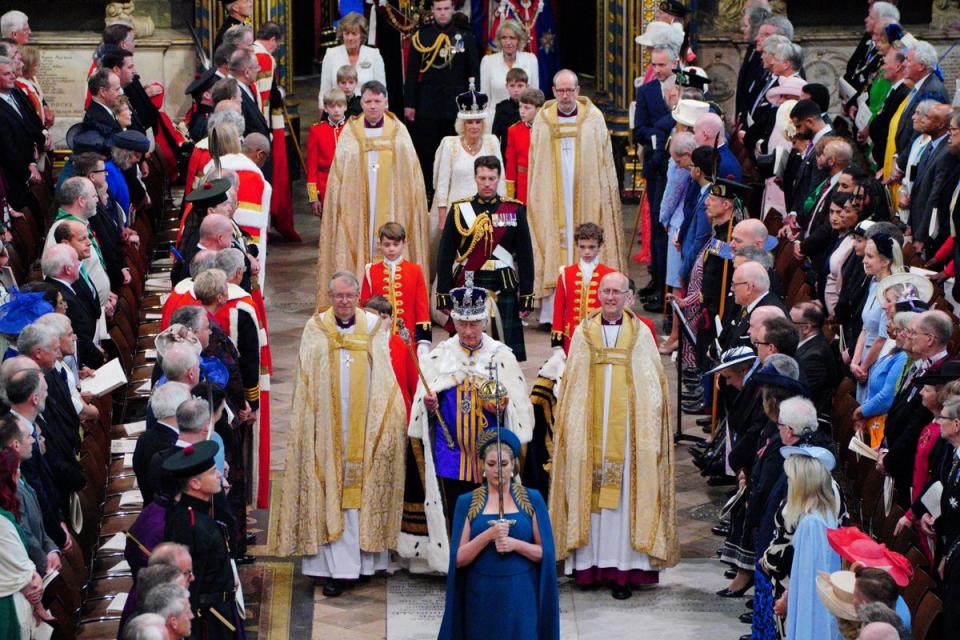 The King, wearing the Imperial State Crown, is followed by Queen Camilla as they leave Westminster Abbey (Ben Birchall/PA) (PA Wire)