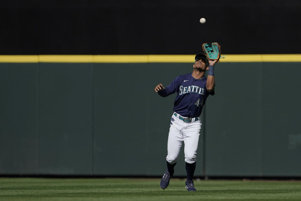 Seattle Mariners center fielder Julio Rodriguez catches a fly ball hit by Chicago White Sox's Eloy Jimenez for an out during the first inning of a baseball game, Monday, Sept. 5, 2022, in Seattle. (AP Photo/Ted S. Warren)