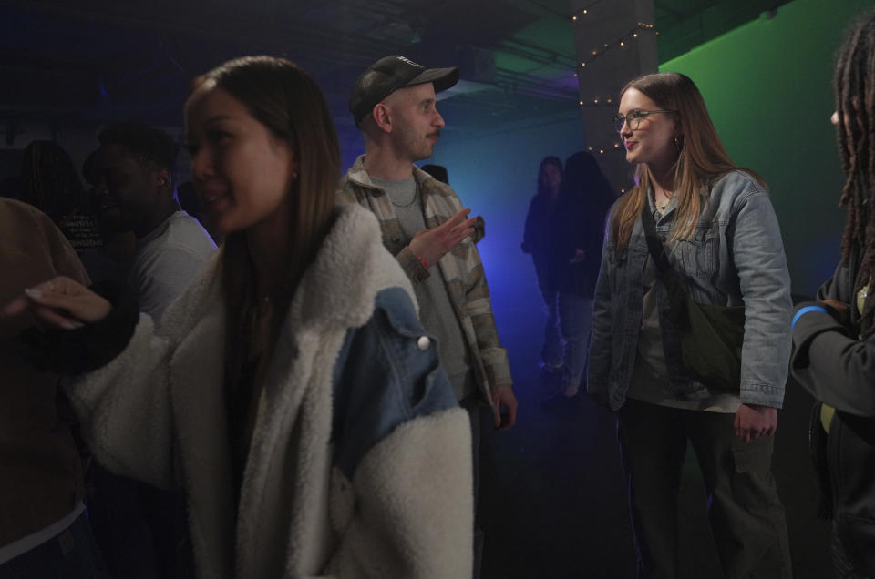Attendees of The Cove, a pop-up, 18-and-up Christian nightclub, participate in ice breakers and "get to know you" prompts on Saturday, Feb. 17, 2024, in Nashville, Tenn. More than 200 racially and ethnically diverse young clubbers attended The Cove's fourth event. (AP Photo/Jessie Wardarski)