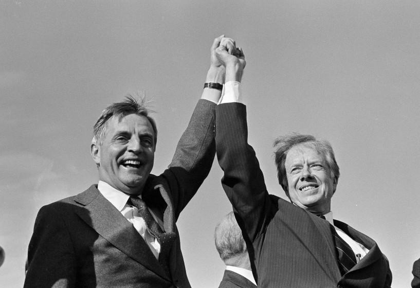 President Jimmy Carter, right, and Vice President Walter Mondale share a victory salute at the Akron-Canton Municipal Airport in Akron, Ohio, Nov. 3, 1980. They addressed a rally of about 4,000 people before taking off for another campaign stop. (AP Photo/Jim Wells)