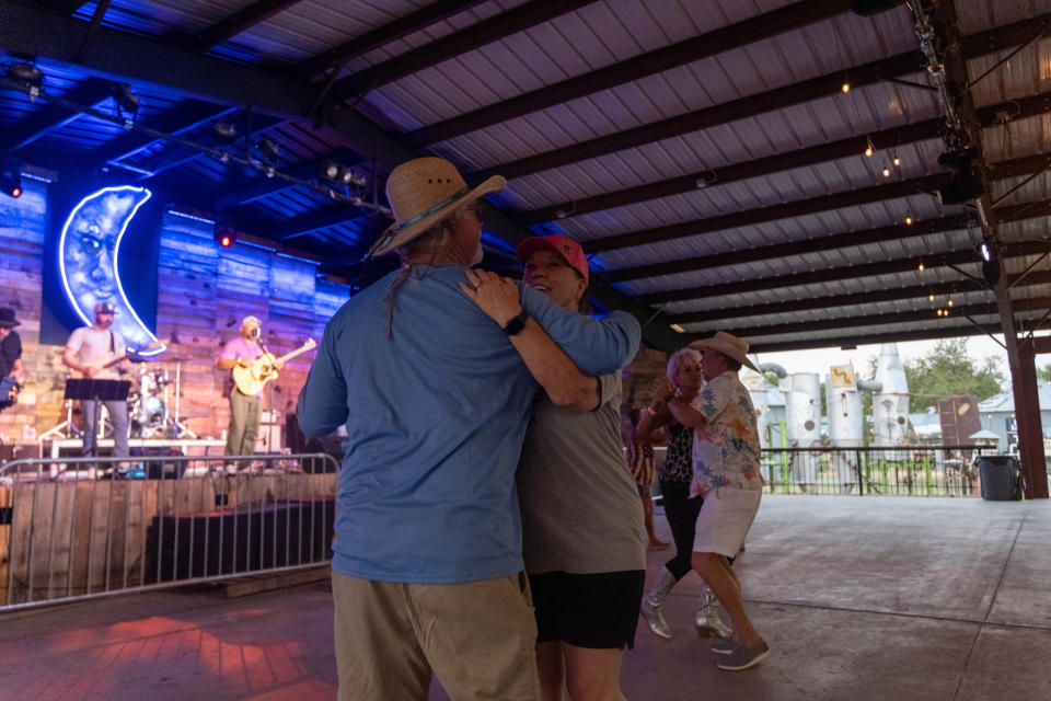 A couple dances to Velvet Funk Saturday evening at the 1st annual Calf Fry Festival at the Starlight Ranch Event Center in Amarillo.