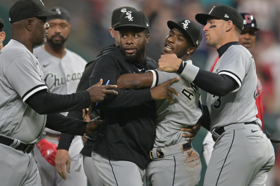 Aug 5, 2023; Cleveland, Ohio, USA; Teammates holds back Chicago White Sox shortstop Tim Anderson (7) after Anderson and Cleveland Guardians third baseman Jose Ramirez (not pictured) got into a fight during the sixth inning at Progressive Field. Mandatory Credit: Ken Blaze-USA TODAY Sports