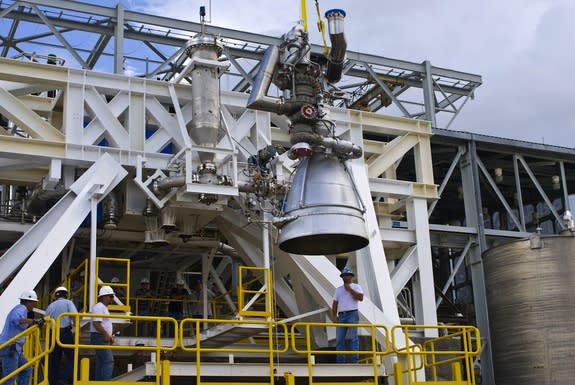 An AJ26 engine is placed in a test stand at NASA's Stennis Space Center.