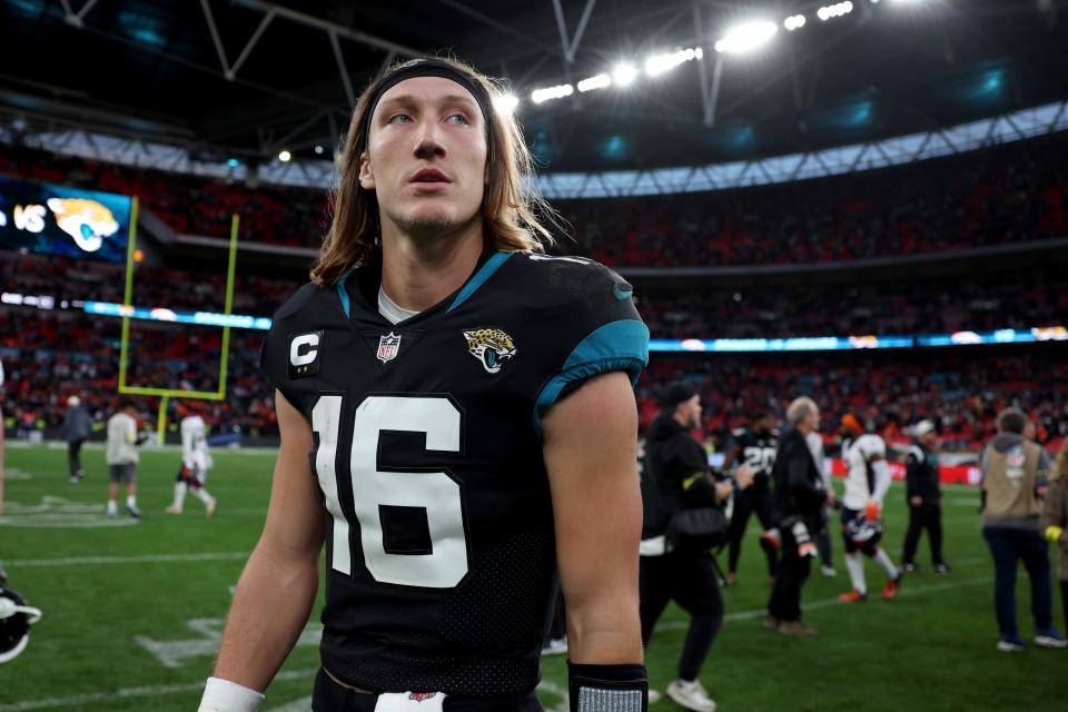 Jacksonville Jaguars quarterback Trevor Lawrence (16) leaves the pitch after the NFL football game between Denver Broncos and Jacksonville Jaguars at Wembley Stadium in London, Sunday, Oct. 30, 2022. Denver Broncos won by 21-17.(AP Photo/Ian Walton)