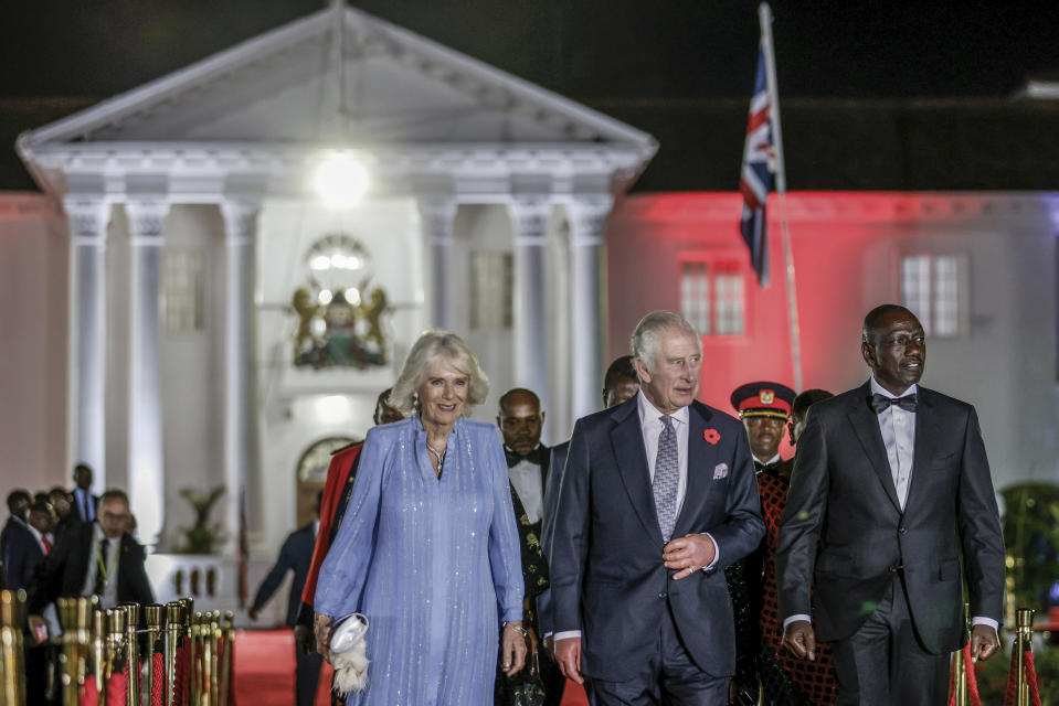 Britain's King Charles III, center, Queen Camilla and Kenyan President William Ruto, right, arrive for the State Banquet at the State House in Nairobi, Kenya, Tuesday Oct. 31, 2023. (Luis Tato/Pool via AP)